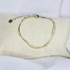 Bracelet modèle Precious Bracelet double chaîne en or et perles sur présentoir