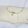Bracelet modèle Starfish Bracelet en or avec étoile de mer sur présentoir